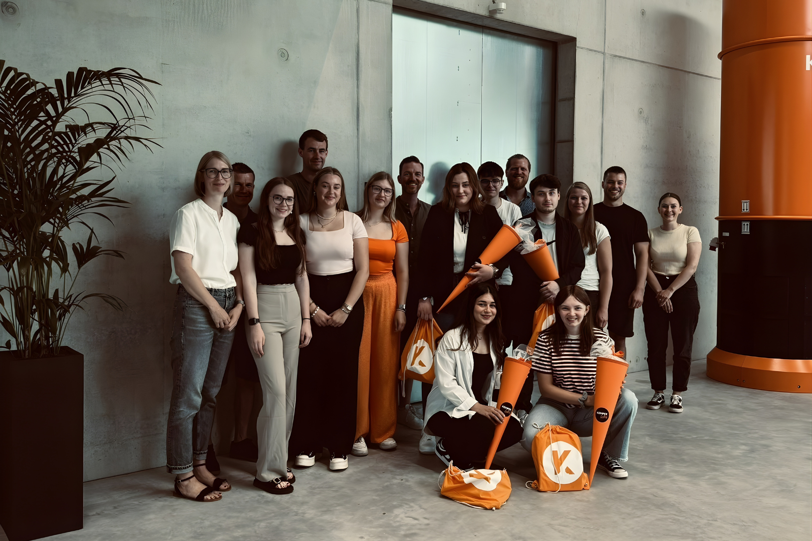 Group of students and apprentices at KEMPER in a modern corporate environment